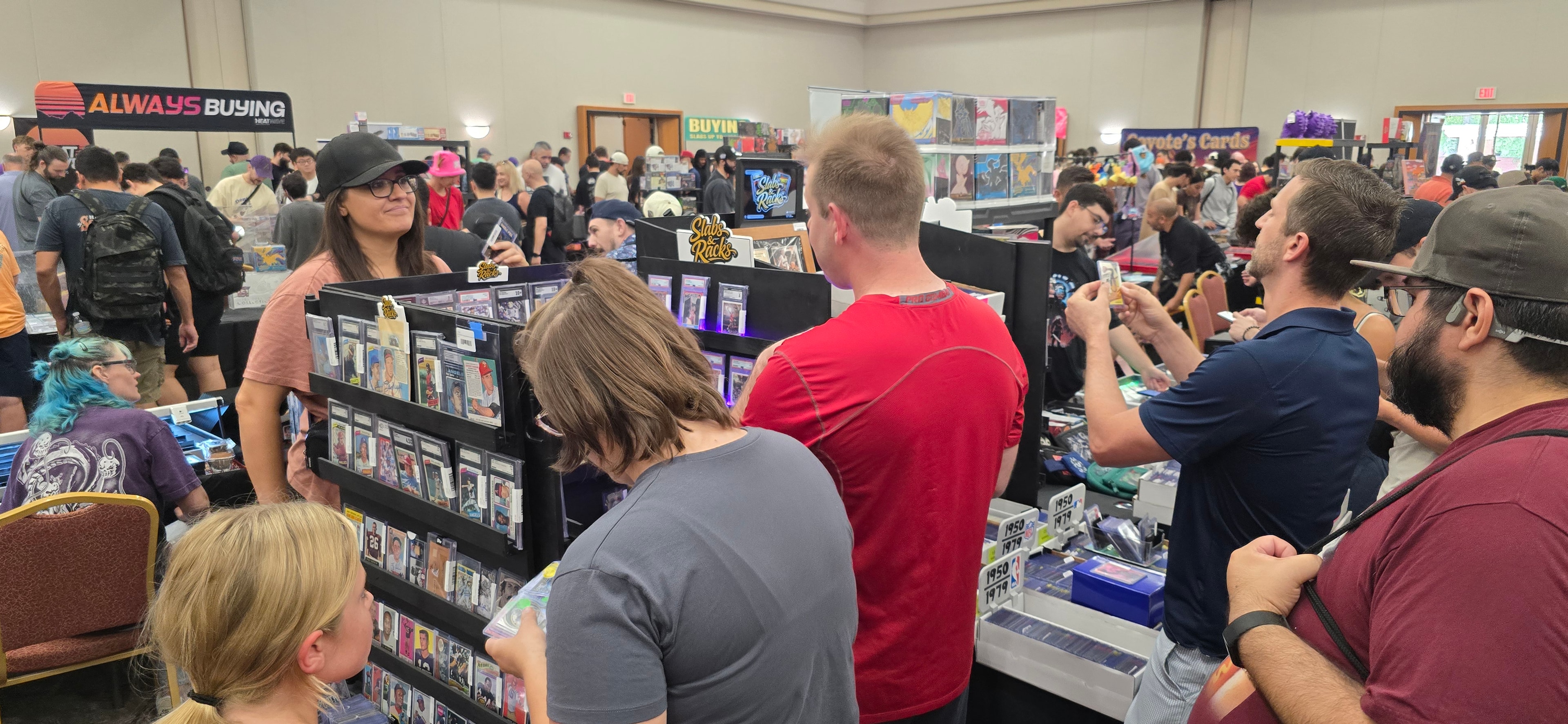 Slabs & Racks booth at a card show with collectors browsing