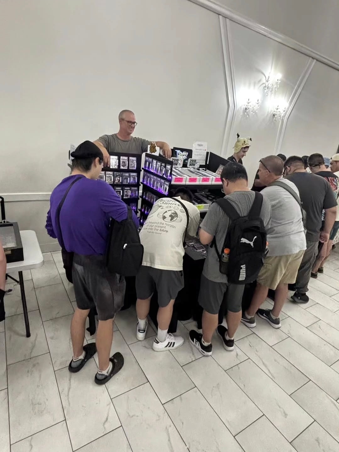 Collectors lined up at the Slabs & Racks table